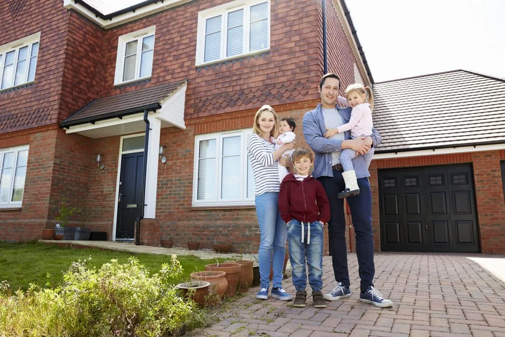 family outside house