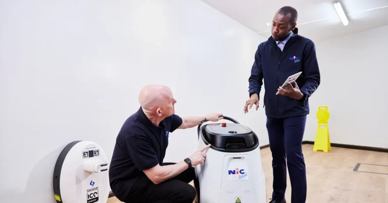 NIC Local franchisee being shown how to use commercial cleaning equipment supplied through the franchise's supplier network